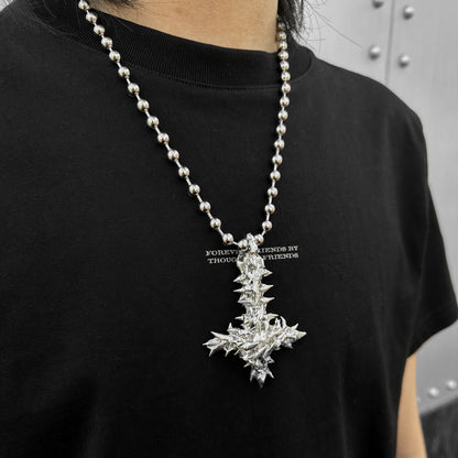 Soldered pearl inverted cross