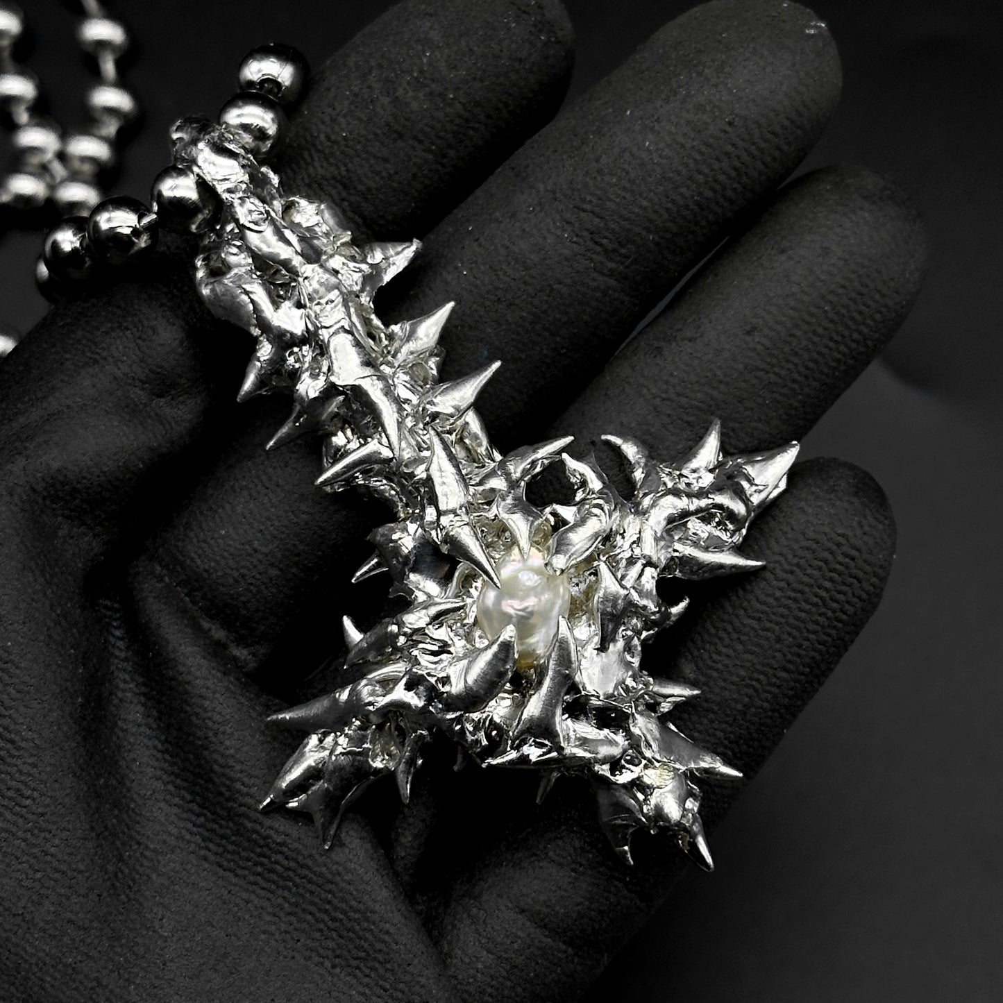 Soldered pearl inverted cross