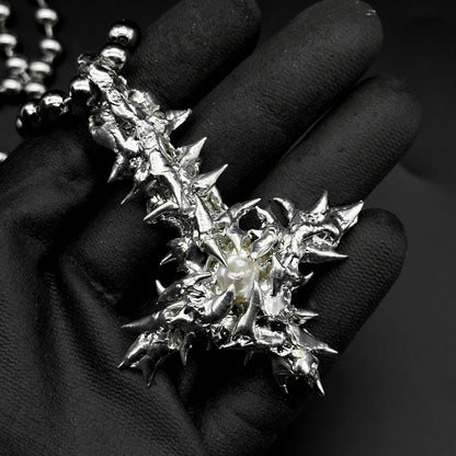Soldered pearl inverted cross
