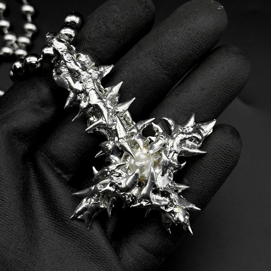 Soldered pearl inverted cross