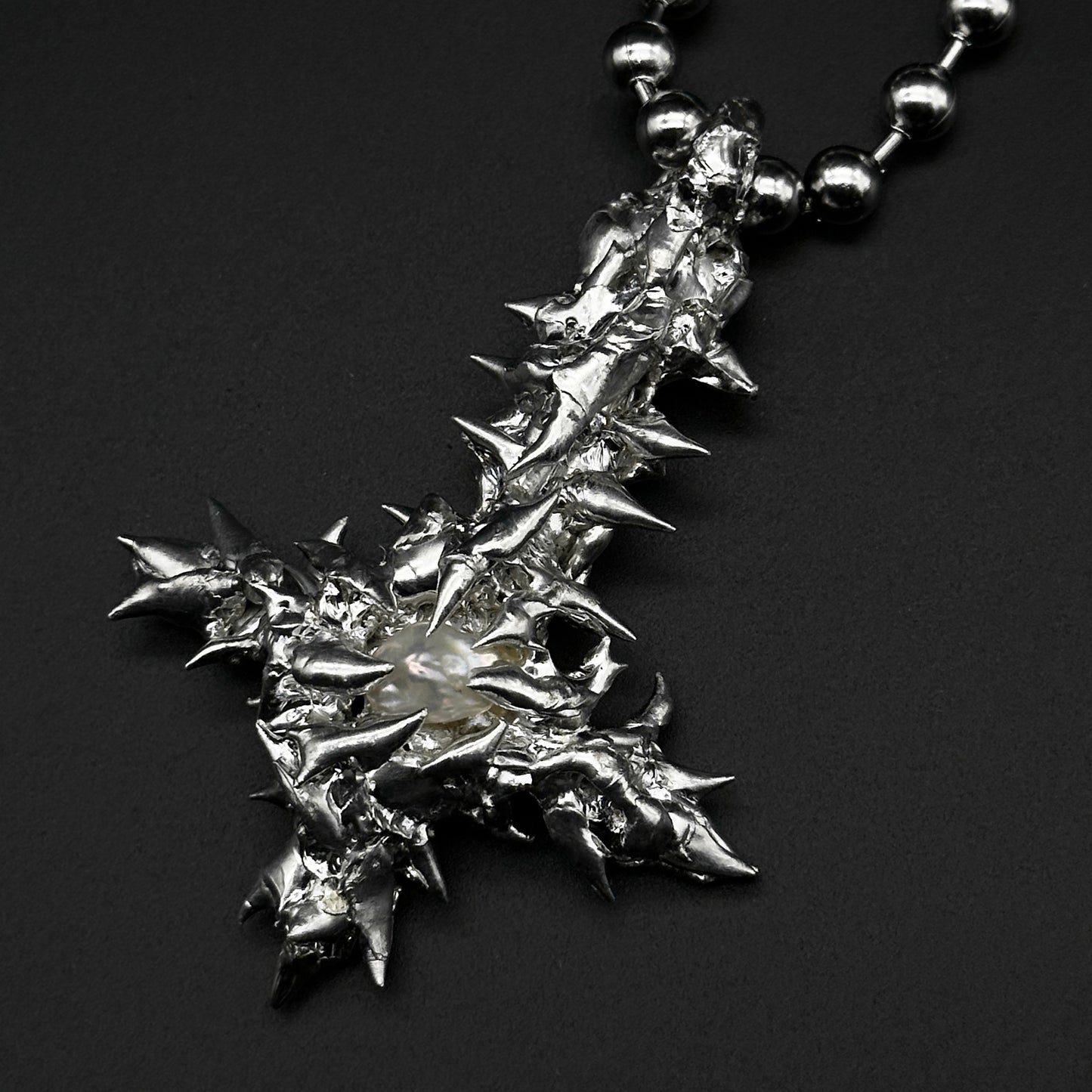 Soldered pearl inverted cross